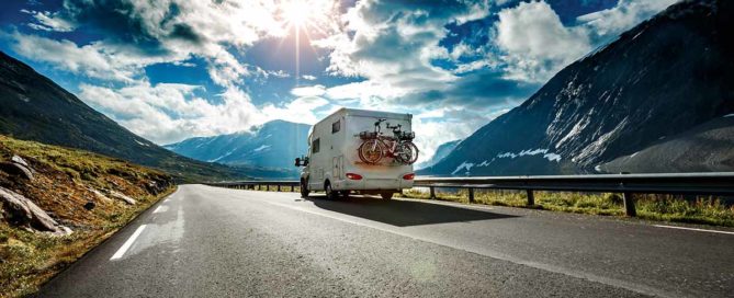 rv on highway in the mountains